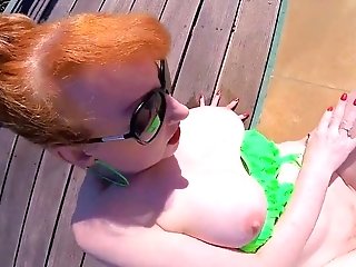 Horny Red-haired Cougar Fucks Herself In The Pool